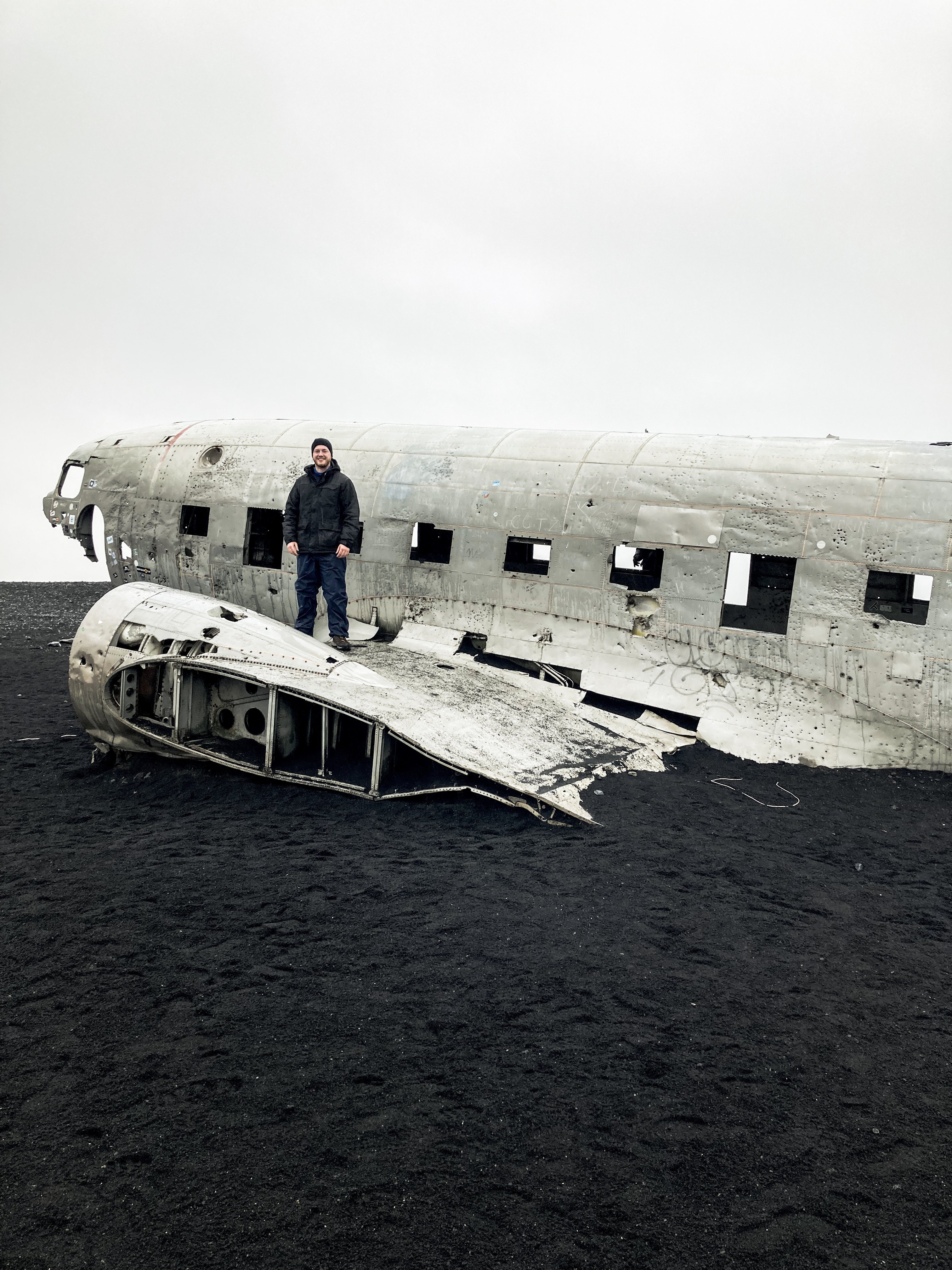 A young man standing on the famous DC-3 Plane Wreck