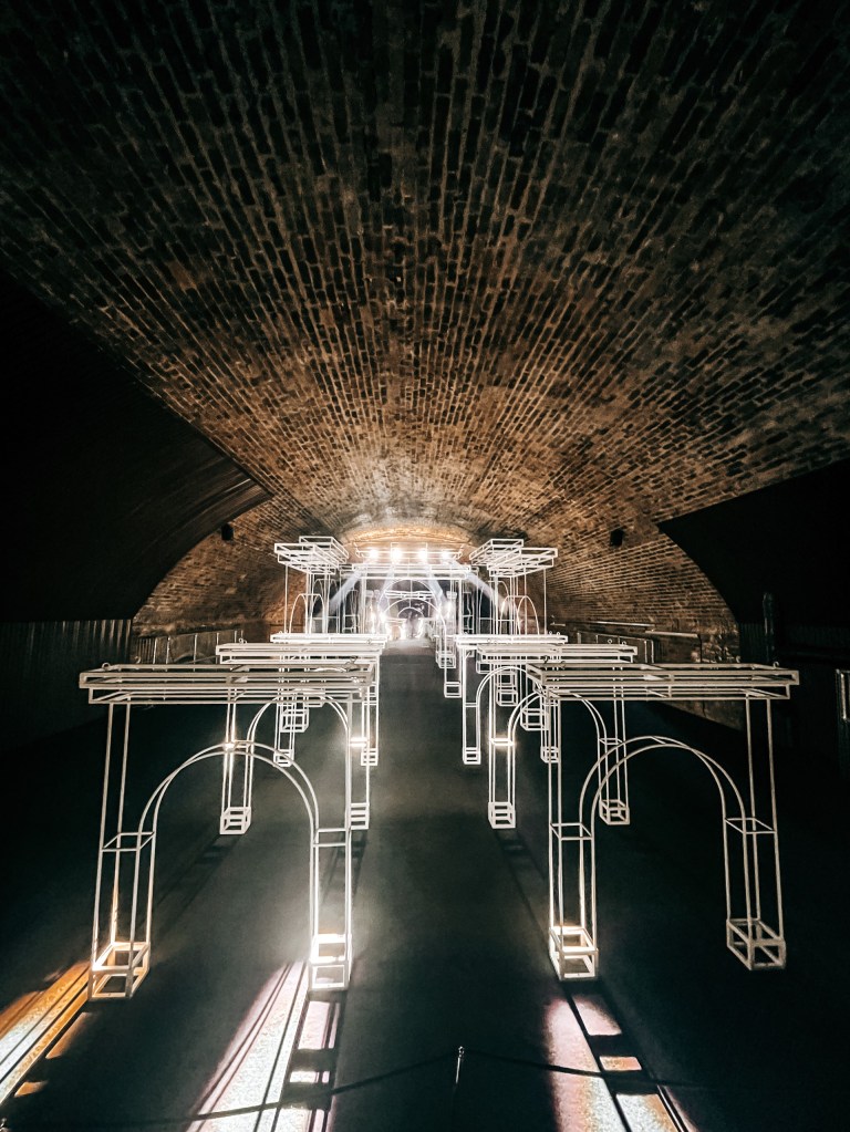 One of the Zones in the Delight Media Art Exhibition, London. Artwork sculpture of giant gates with lighting.